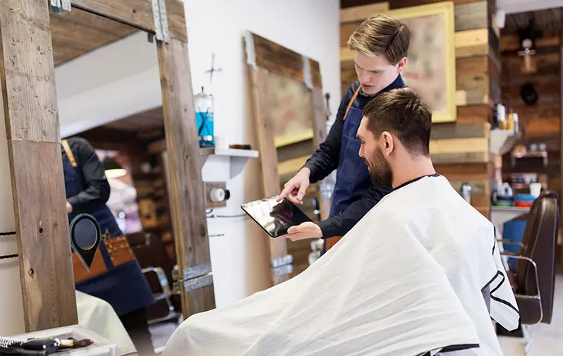 Imagem promocional do sistema de gestão iKropp para barbearias e salões de beleza